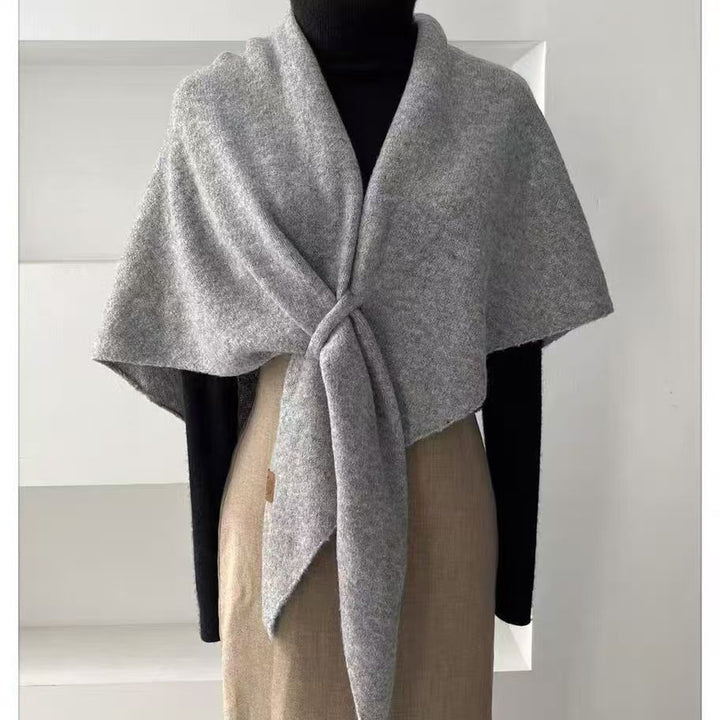 Woman wearing a wool triangle shawl