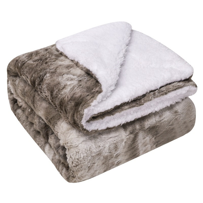 Thick sherpa fleece throw on a sofa