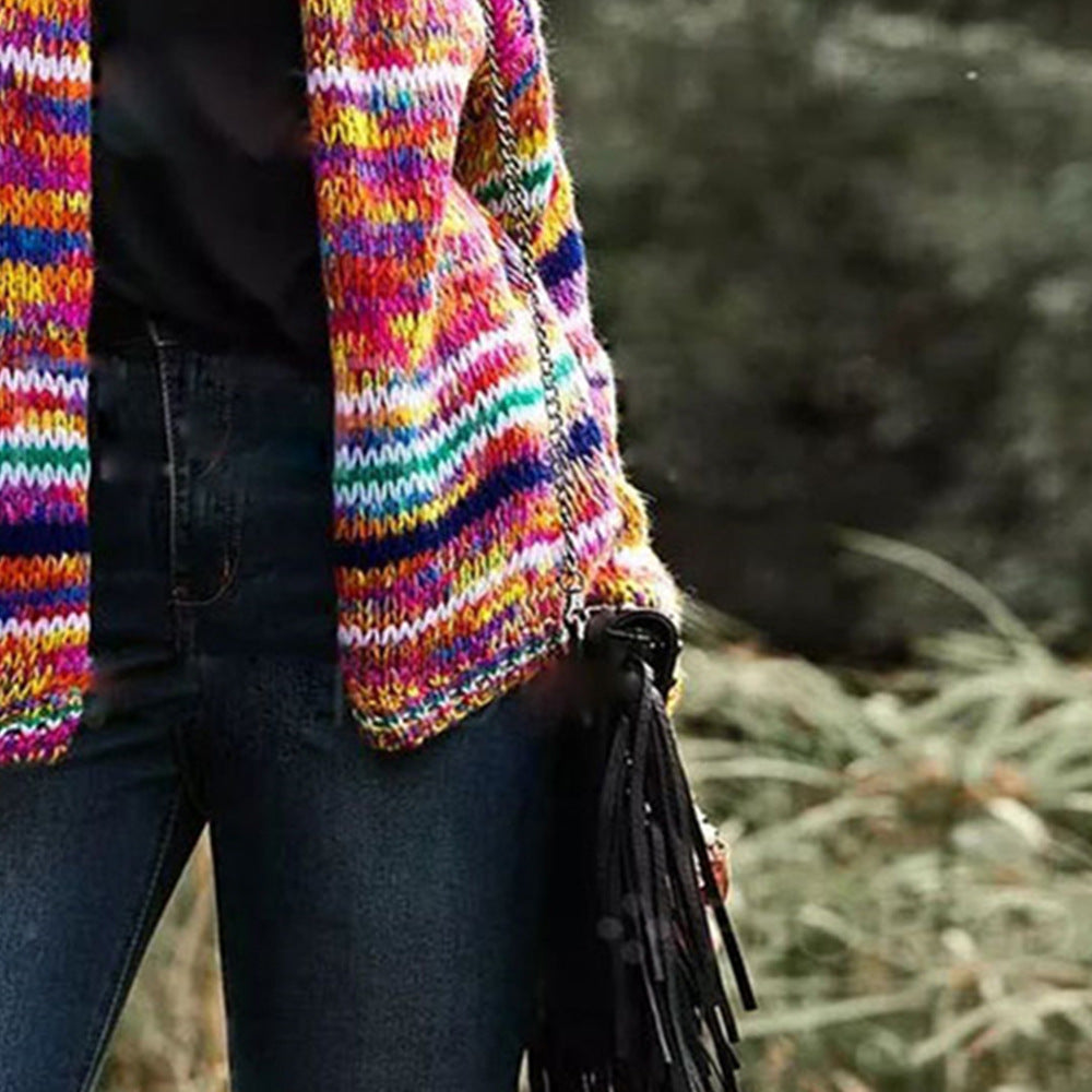 Woman in a rainbow striped chunky cardigan