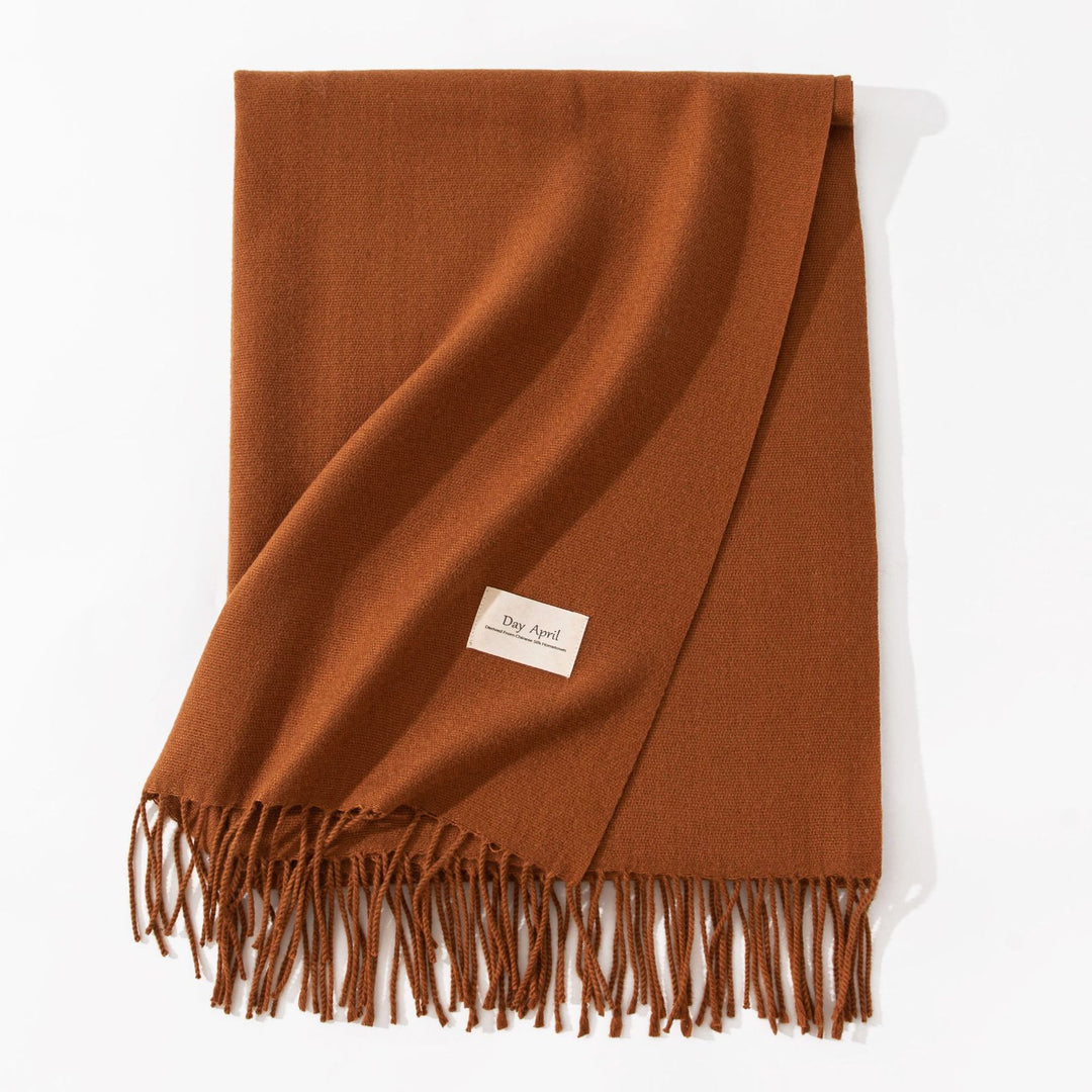 Woman wearing a wide caramel scarf shawl