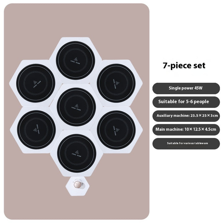 White hexagonal food warming plates joined in a cluster