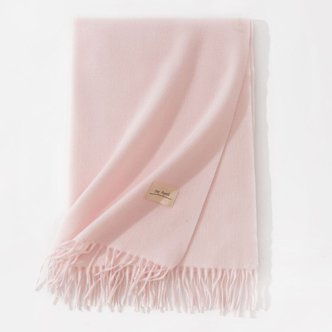 Woman wearing a wide caramel scarf shawl