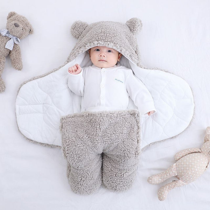 Baby in a plush bear-ear hooded wrap