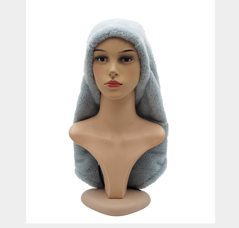 Woman wearing a plush hooded scarf
