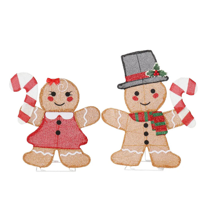 Two lighted gingerbread figures with candy canes