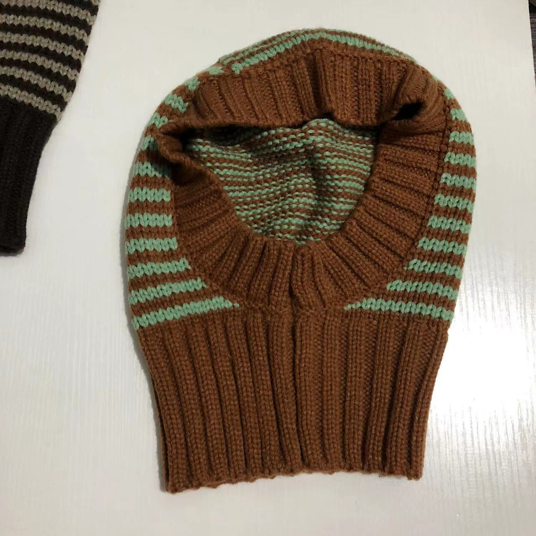 Person wearing striped knit balaclava hood