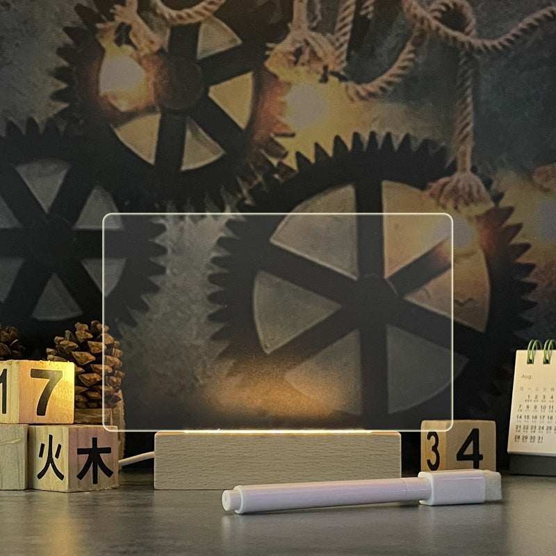 Glowing acrylic message board lamp on wooden base