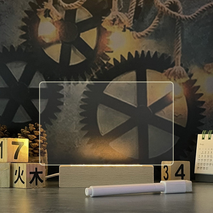 Glowing acrylic message board lamp on wooden base