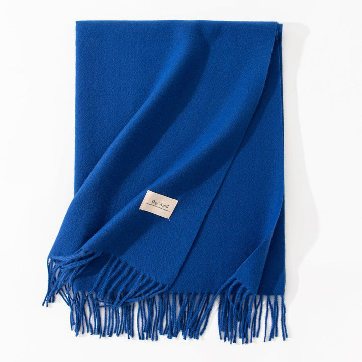 Woman wearing a wide caramel scarf shawl