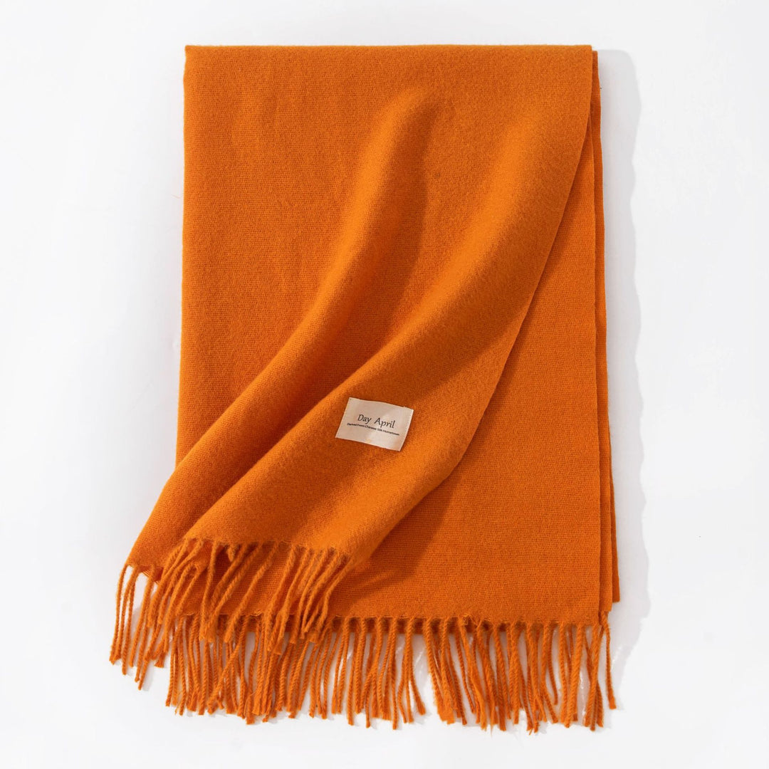 Woman wearing a wide caramel scarf shawl
