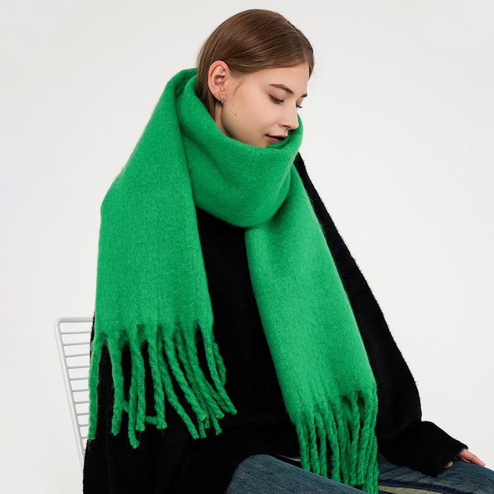 Woman wearing a fluffy royal blue scarf