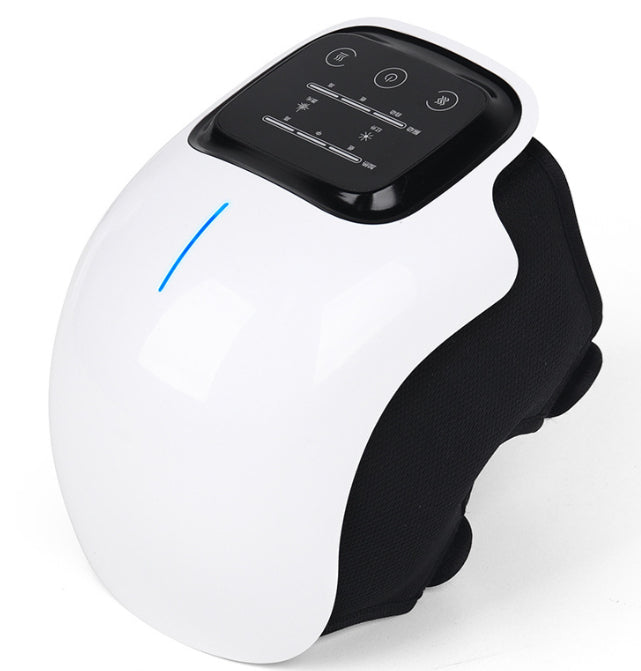 White wearable knee massager wrapped around a knee