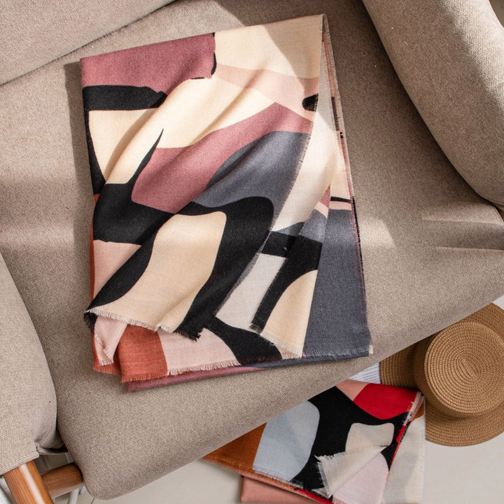 Woman in a mauve abstract print scarf