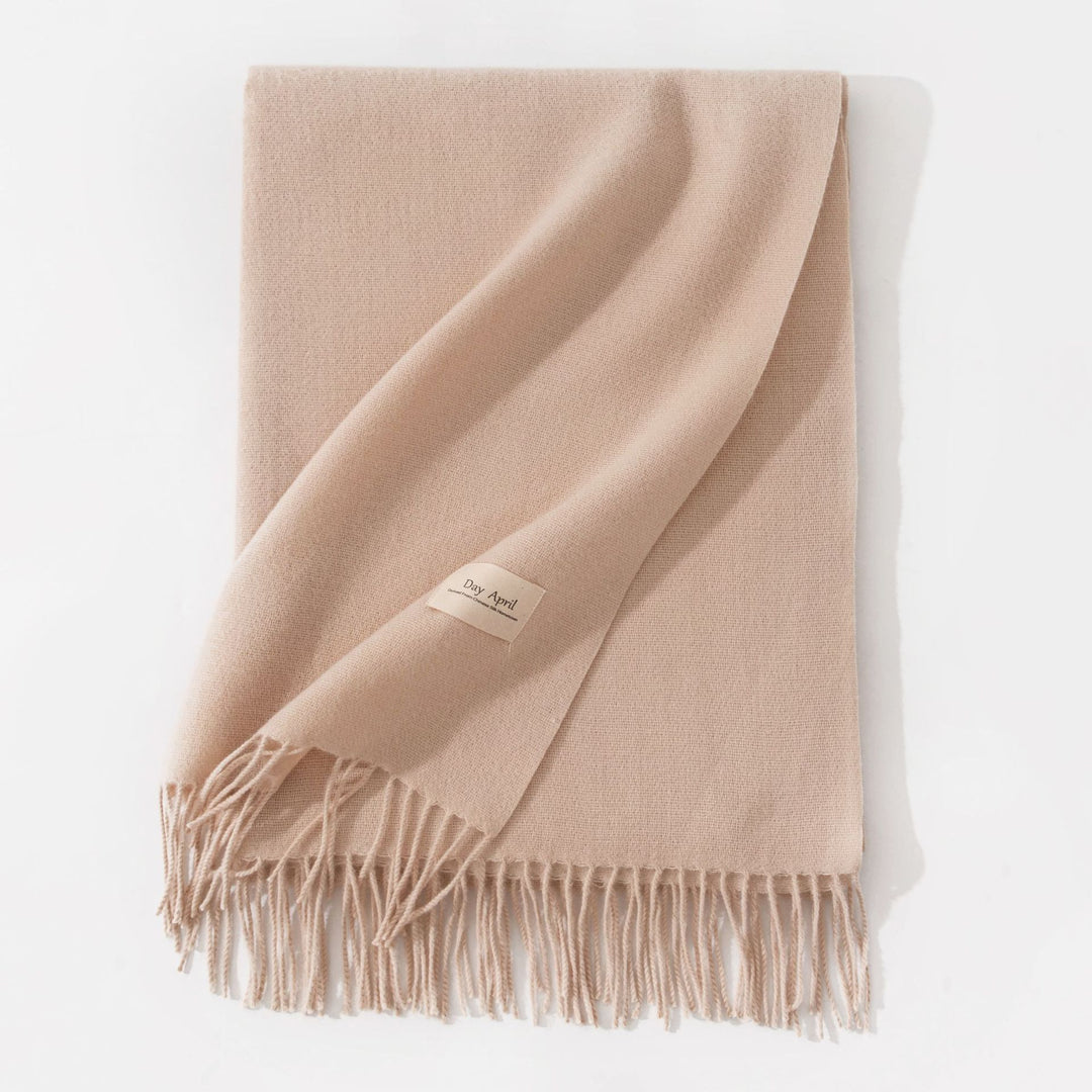 Woman wearing a wide caramel scarf shawl