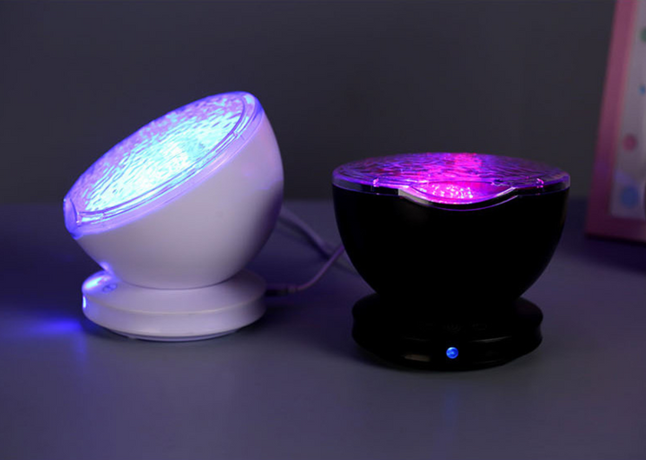 Ocean wave projector lighting a bedroom