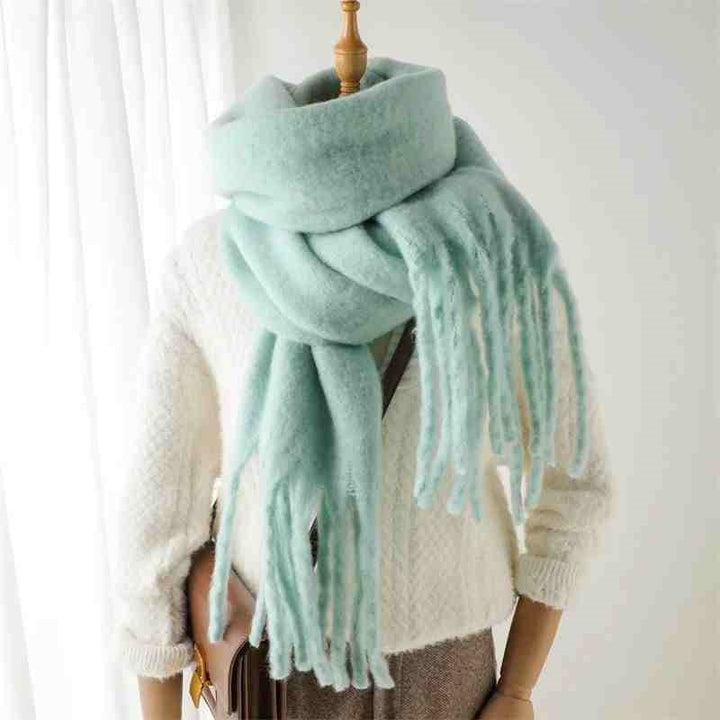 Woman wearing a fluffy mustard scarf