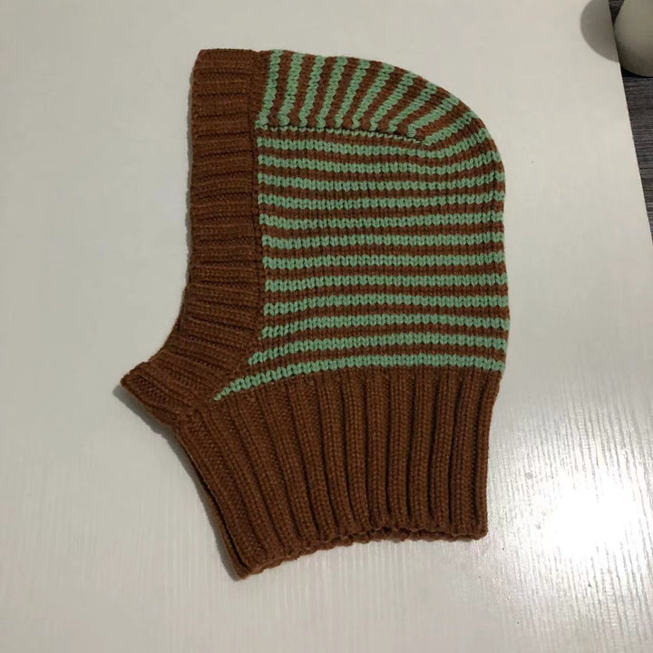 Person wearing striped knit balaclava hood