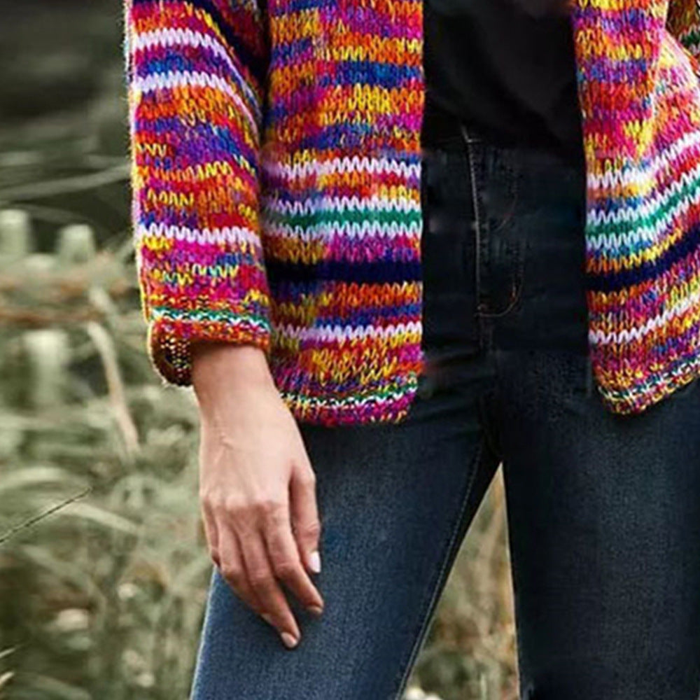 Woman in a rainbow striped chunky cardigan