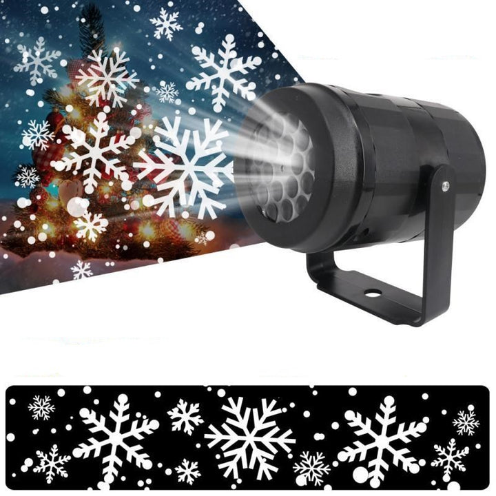 Snowflake projector lighting a house