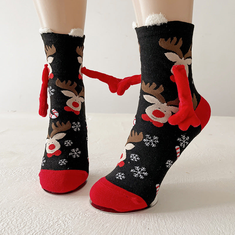 Couple wearing magnetic Christmas socks