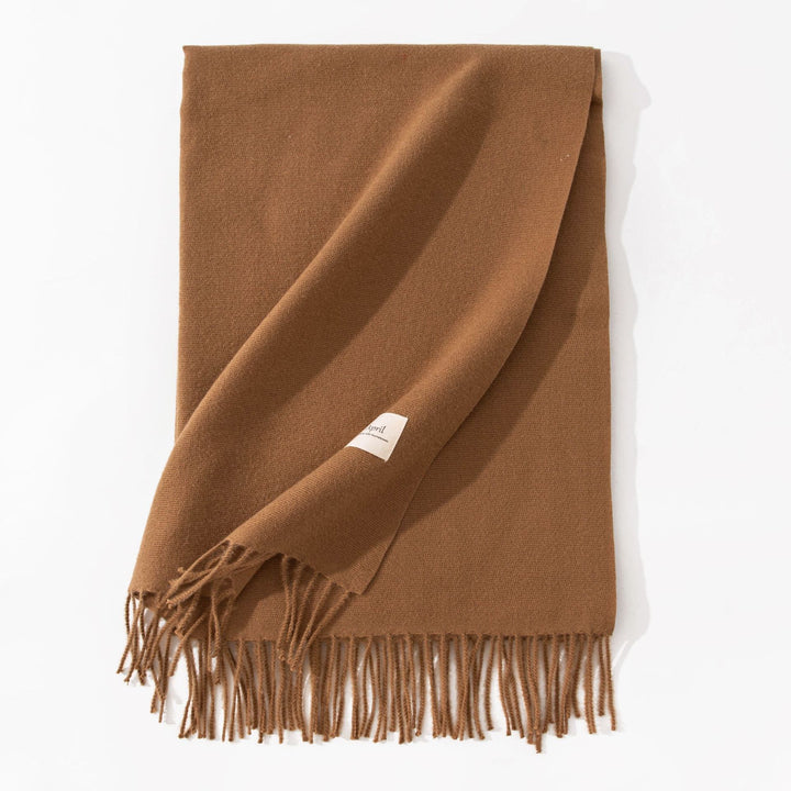 Woman wearing a wide caramel scarf shawl