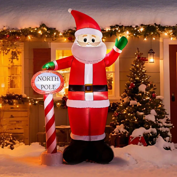 Giant inflatable Santa waving with sign