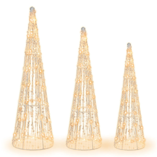 Three lighted cone Christmas trees outdoors