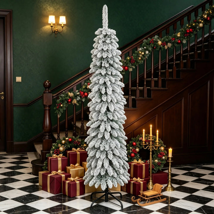 Slim snow flocked pencil Christmas tree in corner