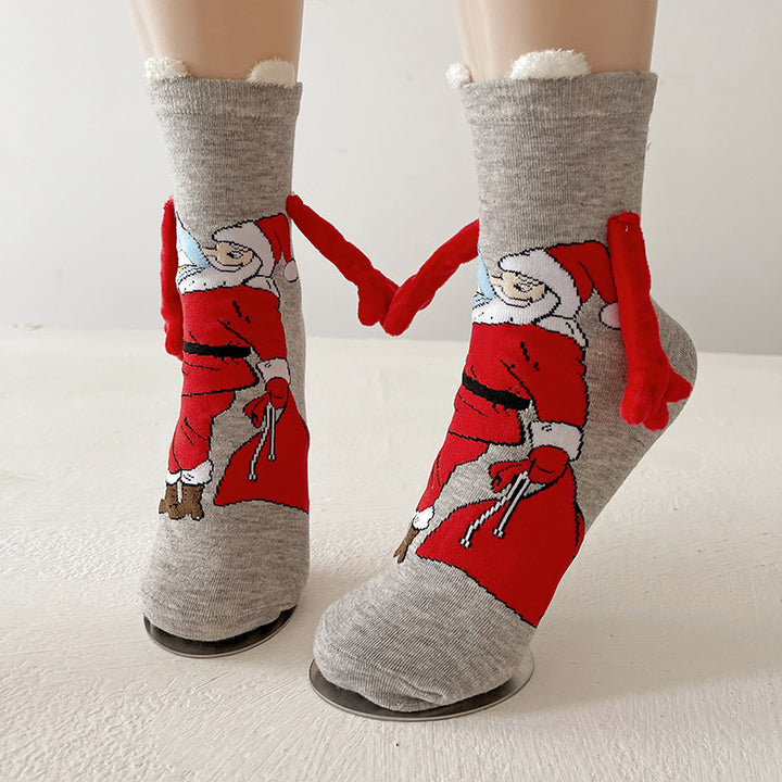 Couple wearing magnetic Christmas socks