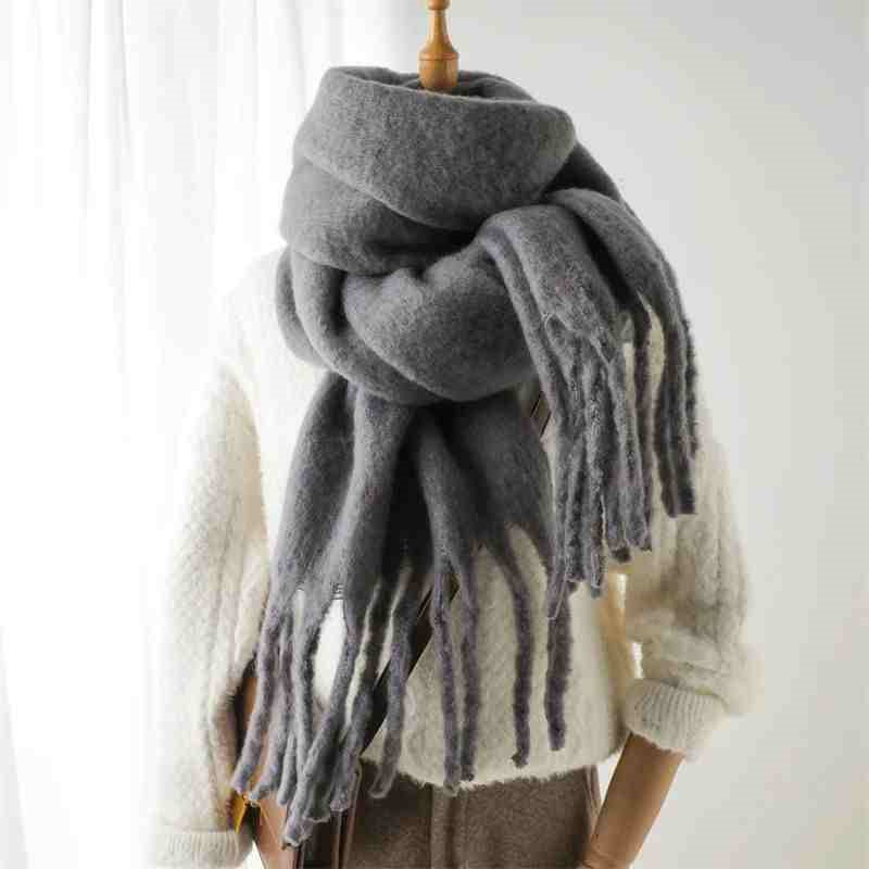 Woman wearing a fluffy mustard scarf
