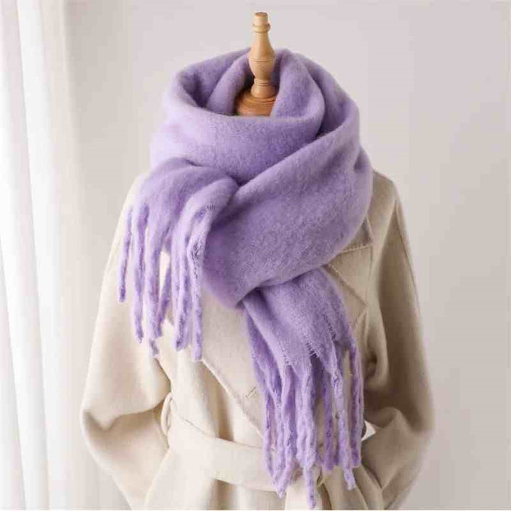 Woman wearing a fluffy mustard scarf