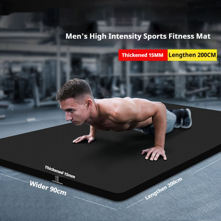 Rolled black yoga mat with carry strap
