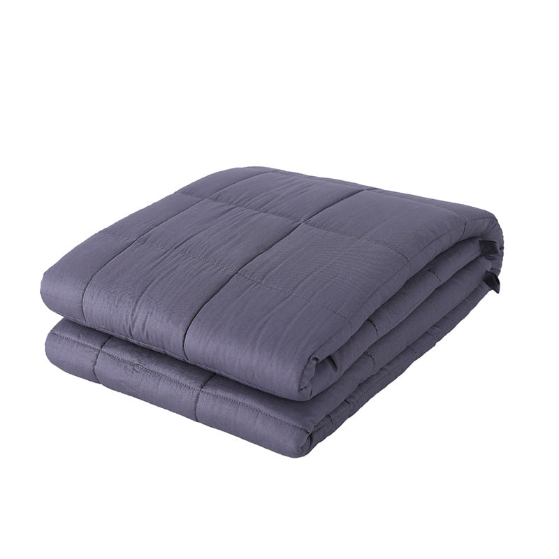 Quilted weighted blanket on a bed