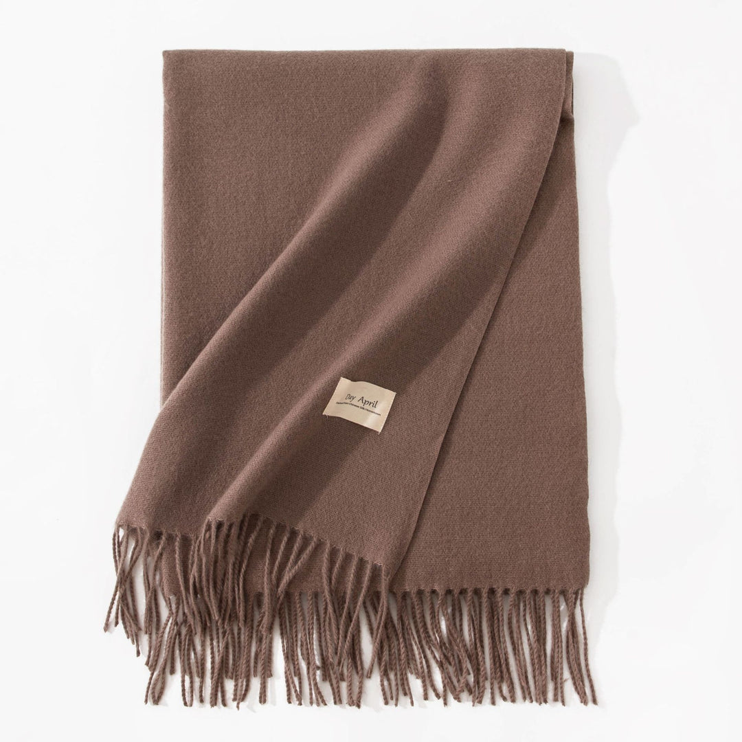 Woman wearing a wide caramel scarf shawl