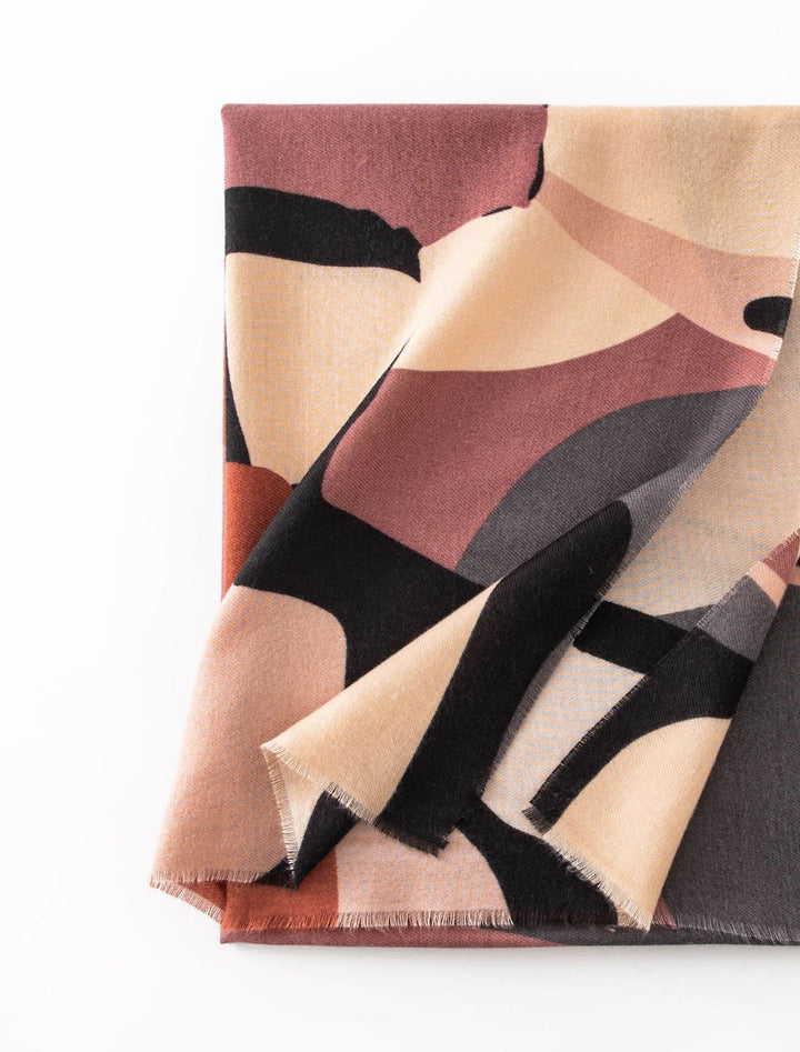 Woman in a mauve abstract print scarf