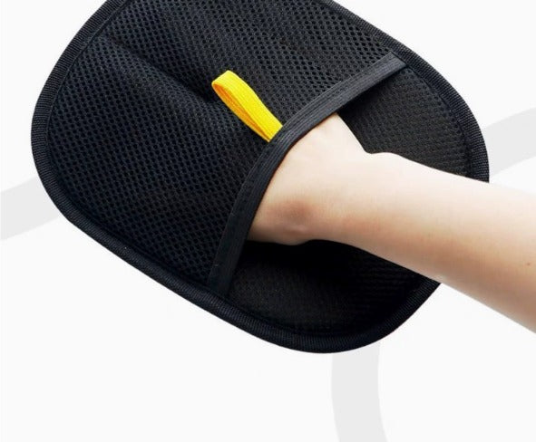 Pet hair remover glove on dog