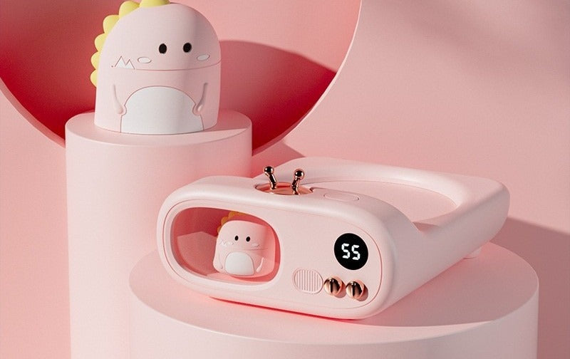 TV-shaped mug warmer with dinosaur figure