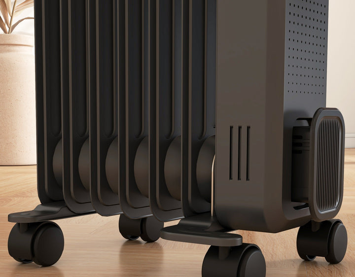 Dark gray oil-filled radiator on castor wheels