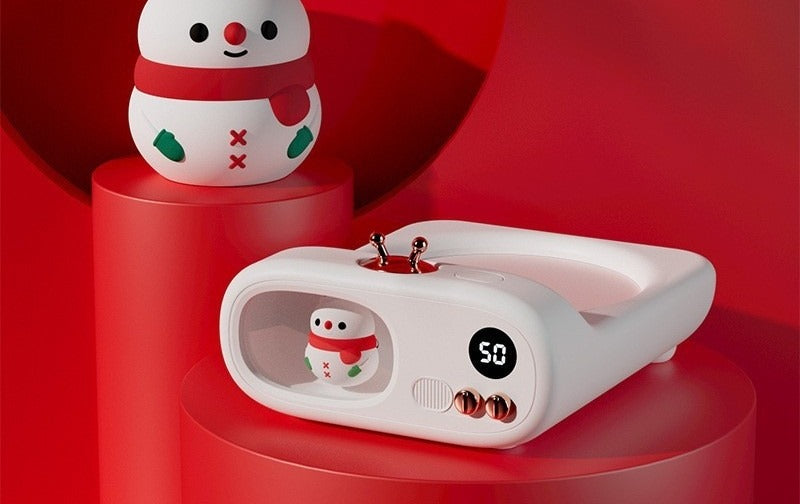 TV-shaped mug warmer with dinosaur figure