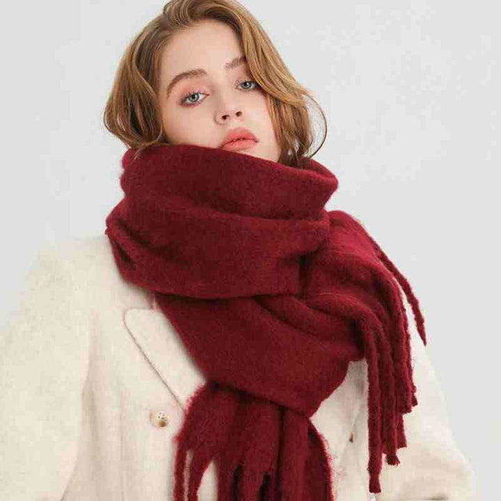 Woman wearing a fluffy mustard scarf