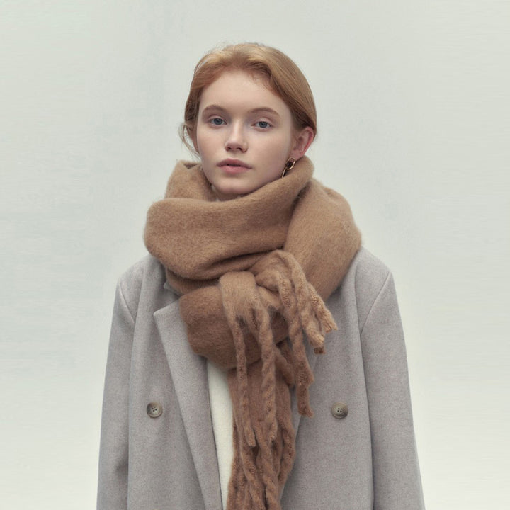 Woman wearing a long camel scarf