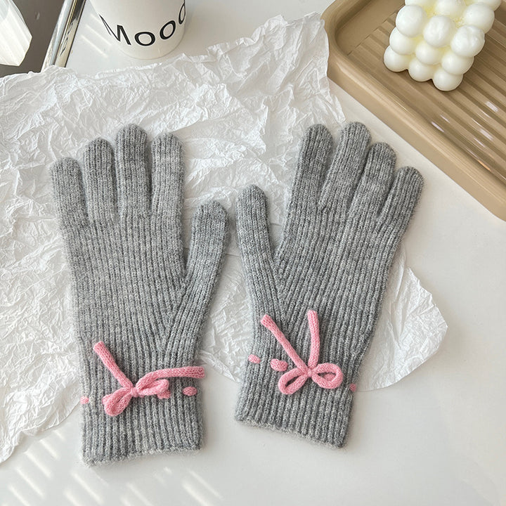 Pink ribbed knit gloves with bow