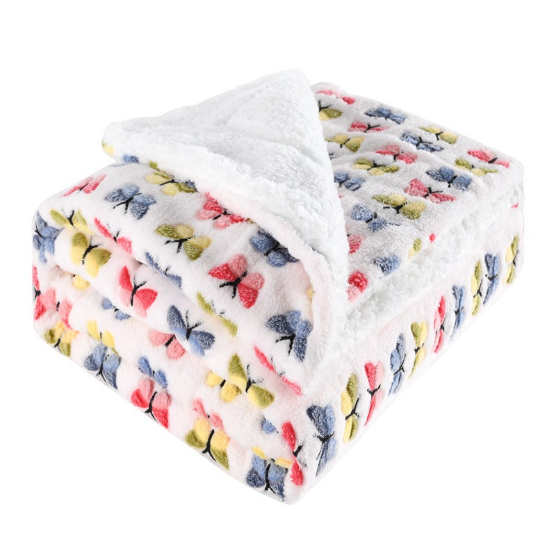 Thick sherpa fleece throw on a sofa