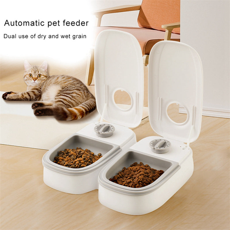 Timed pet feeder with dial and lid