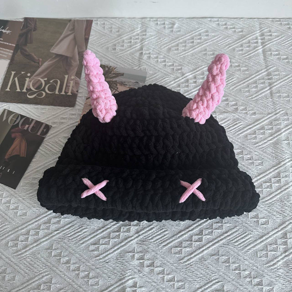 Black chunky crochet bucket hat with pink horns