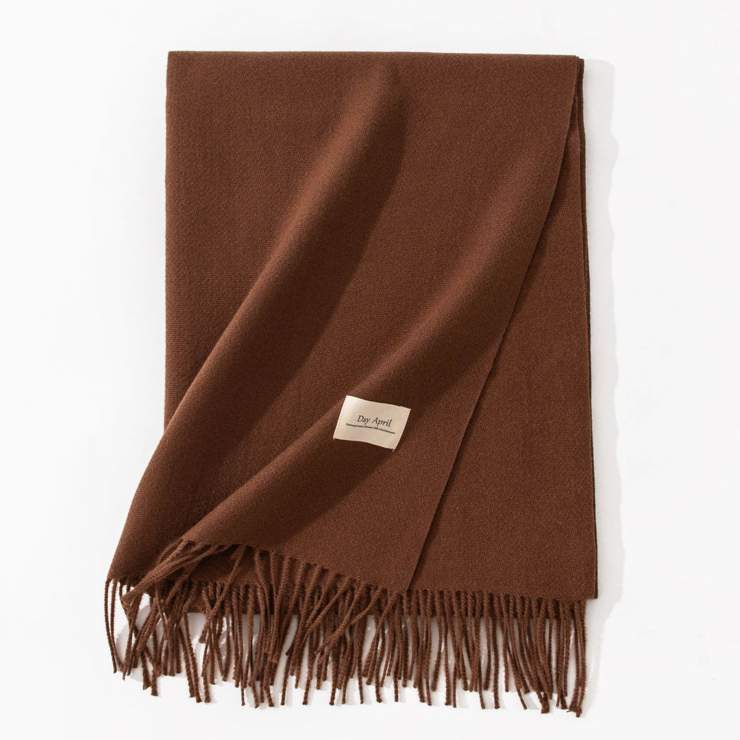 Woman wearing a wide caramel scarf shawl