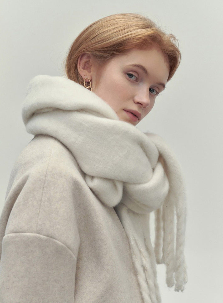 Woman wearing a long camel scarf