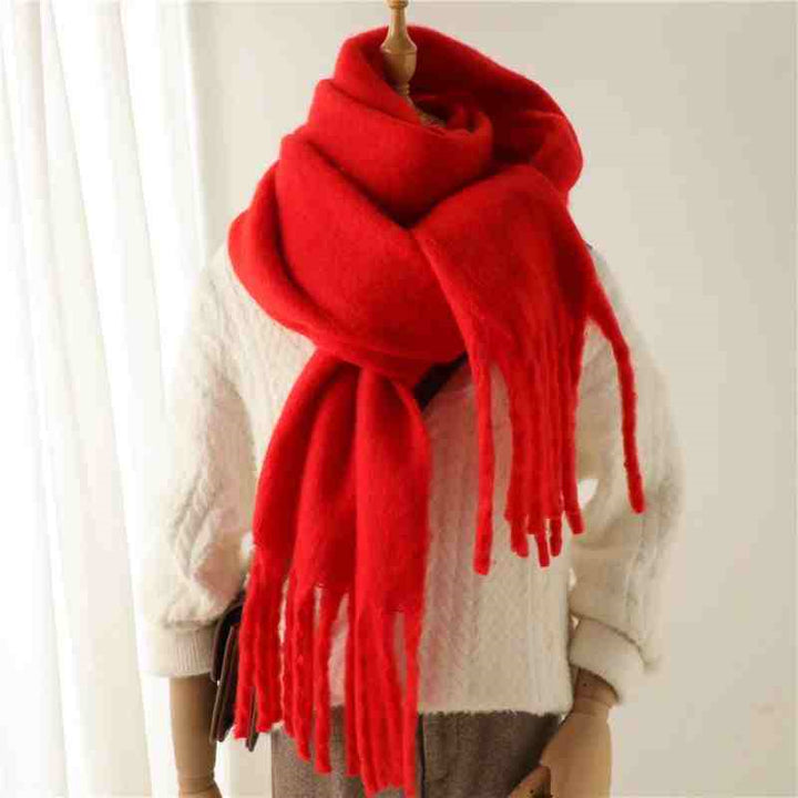 Woman wearing a fluffy mustard scarf