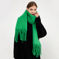 Woman wearing a fluffy royal blue scarf