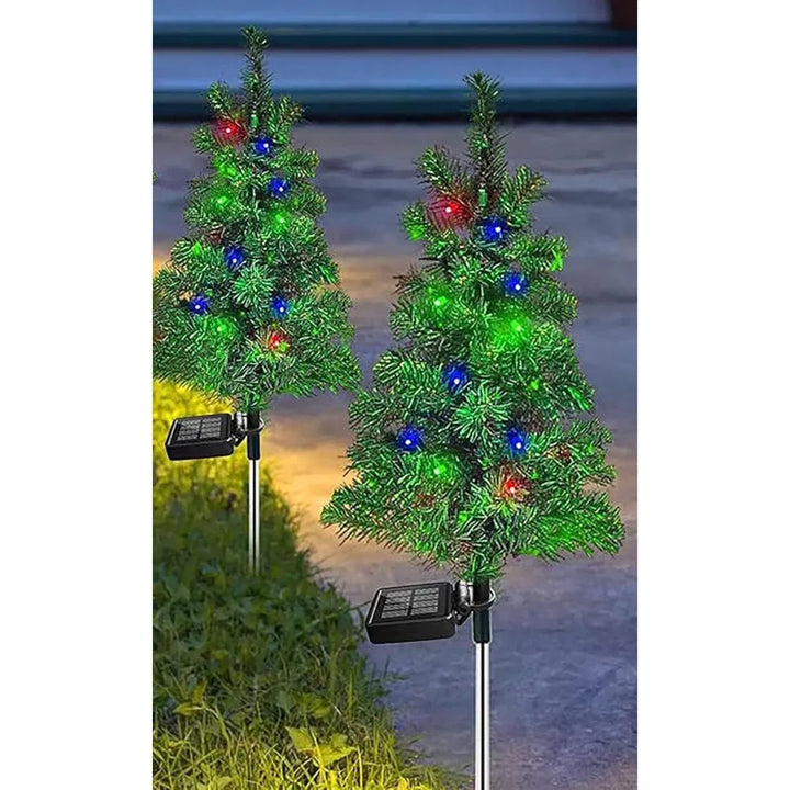 Solar Christmas tree stake lights on path
